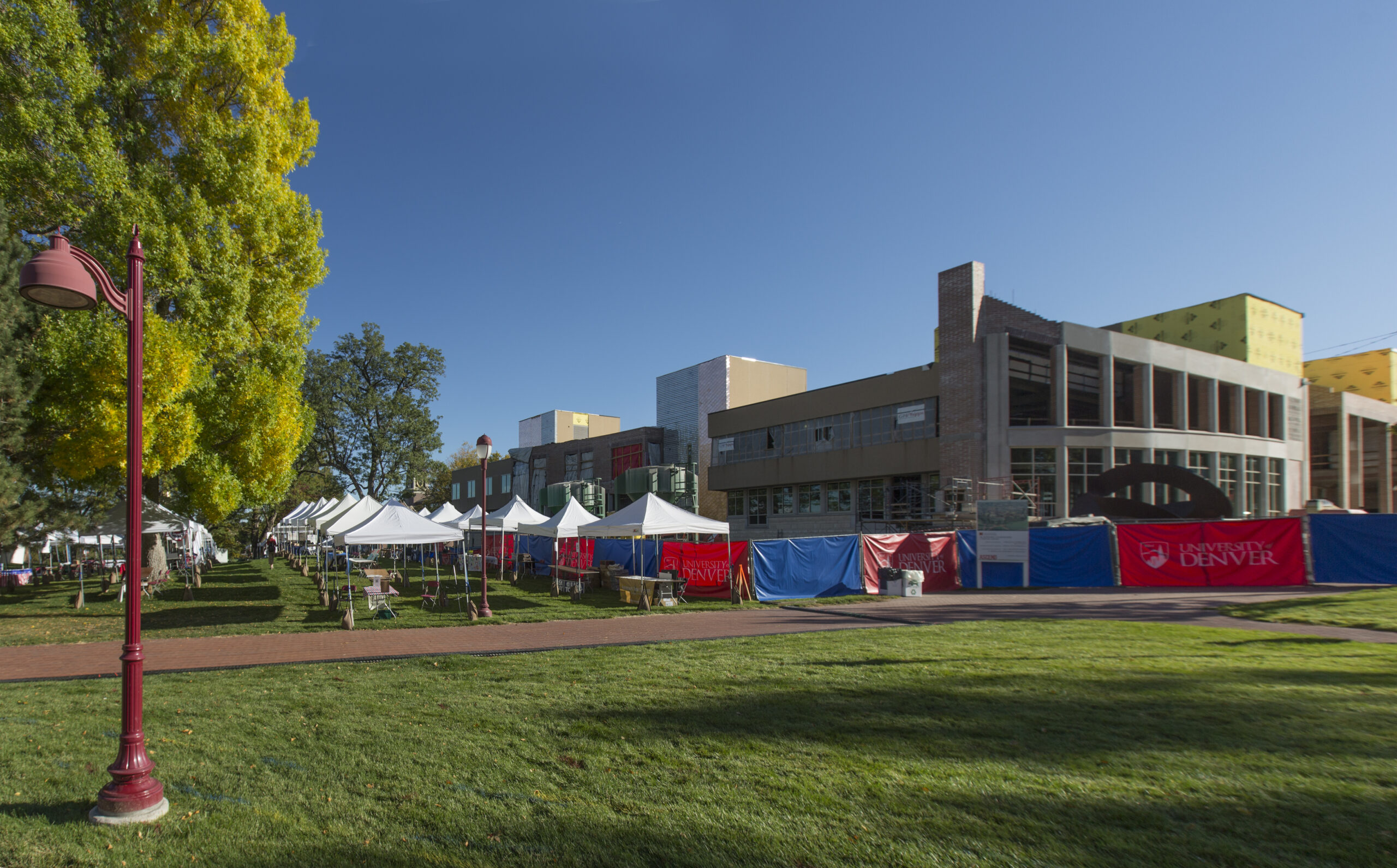 the-university-of-denvers-pre-debate-festivities-take-shape-as-crews-erect-booths-and-much-more-in-preparation-for-debatefest